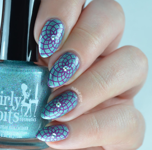 teal holographic nail polish with purple stamping