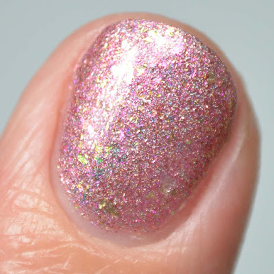 pink flakie nail polish close up swatch