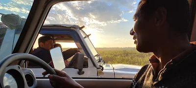 Two fellows meeting by the sunset