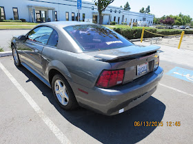 Old Mustang with faded paint and dents before repairs at Almost Everything Auto Body