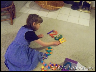 Supergirl Laying out the 3D Numerals