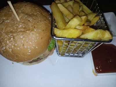 " Chicken burger and fries from XO lounge in Paramaribo"