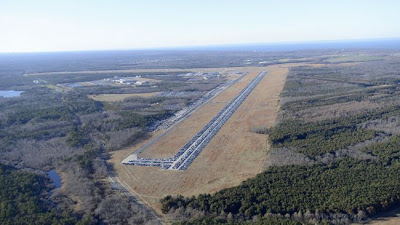 Hurricane Sandy-ravaged vehicles line the runways at Calverton Executive Airport on Long Island.