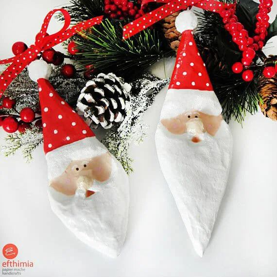 pair of whimsical paper mache Santa tree ornaments