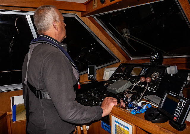 Photo of Phil at the helm of Ravensdale on our way to back to Maryport