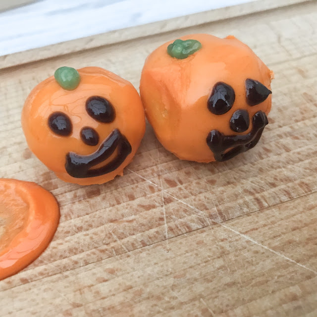 Pumpkin bites with faces iced on