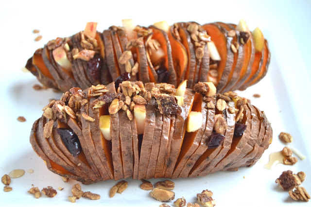 Stuffed Hasselback Sweet Potatoes- loaded with sweet apples, dried cherries, pecans, maple syrup and protein granola for breakfast or dessert! www.nutritionistreviews.com