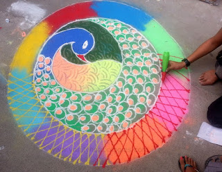 making rangoli on uttarayan