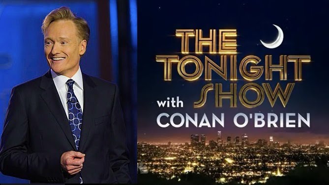 medium shot of Conan O'Brien with Tonight Show title card