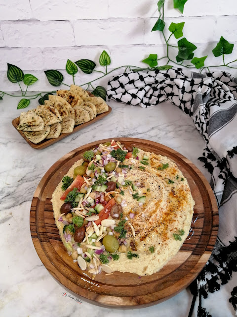 Palestinian Hummus, Palestinian food, Palestinian cuisine, hummus, Palestine, Middle Eastern cuisine, food, food blog, food blogger, food photography, tiktok food, tiktok recipe, chickepeas, garlic, keffiyeh, pinterest food, food flatlay, Palestinian pita bread, pita bread, Palestine London march, olives, olive oil, za'atar, sumac, tanini, home-made hummus, hummus recipe, loaded hummus, healthy food, healthy recipe, appetiser, appetizer, side dish, easy recipe, almonds, spicy fusion kitchen