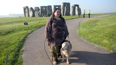 Maia Scott with her Golden guide Tessa at Stonehenge