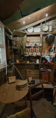 Colour photo showing recreation of part of a sleeping hut at Knockaloe Internment Camp