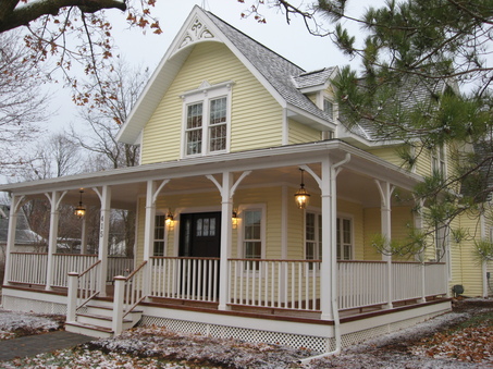 would love a wrap around porch with cute chairs and and a bench ...