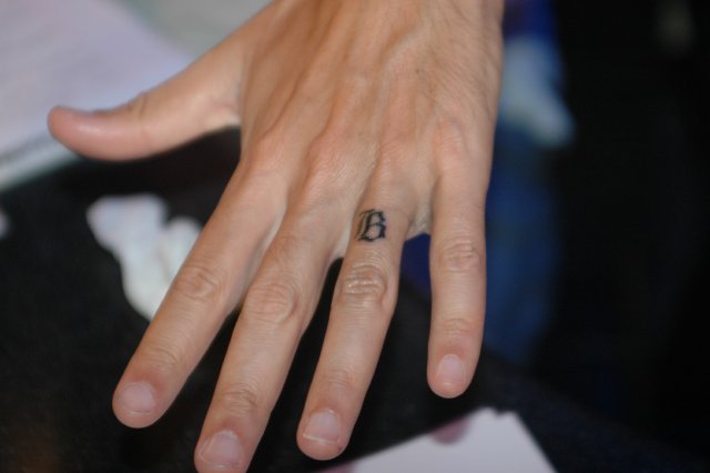 ring finger tattoo to show