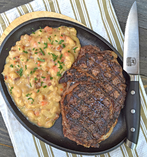 Certified Angus Beef Ribeye Steak with White Beans and Bacon