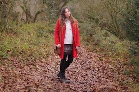 Girl in a red coat in winter