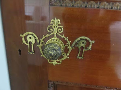 gilt detail around doorknob