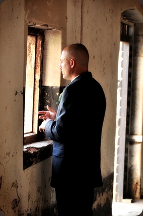 Groom looking through window - Joretha Taljaard Wedding Photography