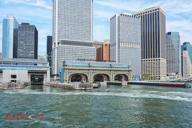  The docks of the Staten Island Ferry terminal, Lower Manhattan seen from Manhattan Harbor.  Travel photography by Kent Johnson.