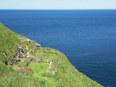 Dwellings on cliff side at Tintagel Castle