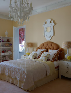 Lovely Bedroom with White Chandelier, Brown Bed, White Quilt, White Bookshelves and Yellow Wall in Moscow Apartment