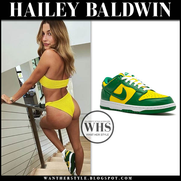 Hailey Baldwin wearing yellow bikini and yellow and green sneakers