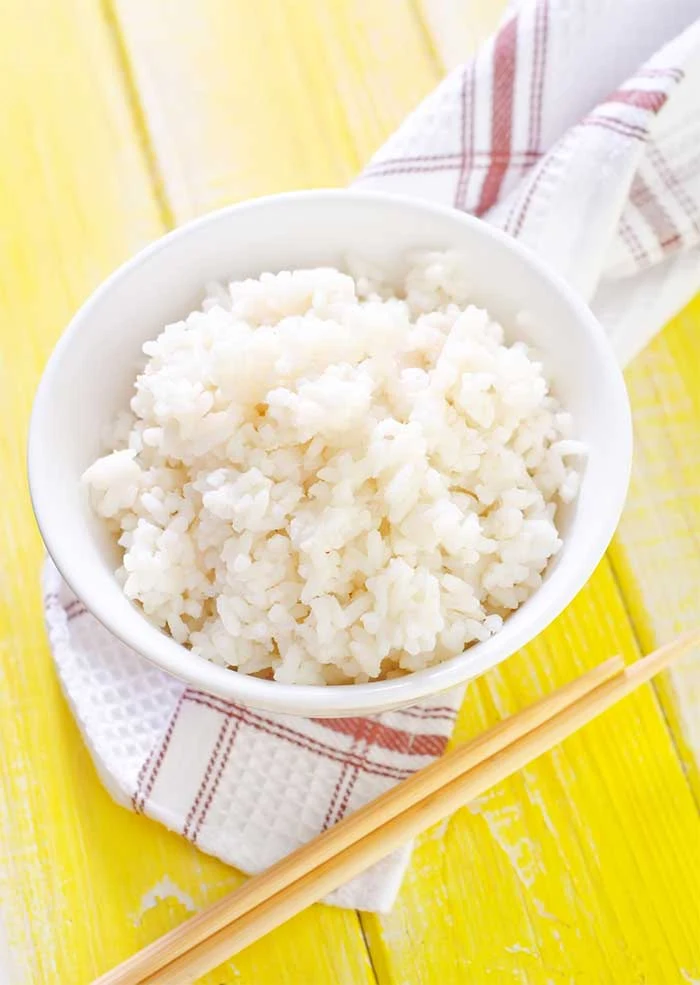 How to cook perfect rice in the Instant Pot pressure cooker.  Learn about the best ratio of rice to water and cooking time for the best sticky, fluffy white rice.  Cook white long grain rice for meals or side dishes with this guide.  Using the Instant Pot makes cooking rice so easy!  #rice #instantpot 