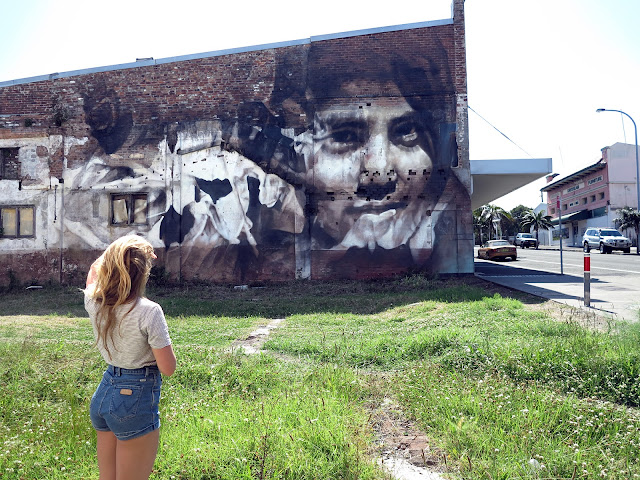 Guido Van Helten is still in Australia where he just finished a brand new portrait somewhere on the streets of Port Kembla, a suburb of Wollongong 8 km south of the CBD and part of the Illawarra region of New South Wales.