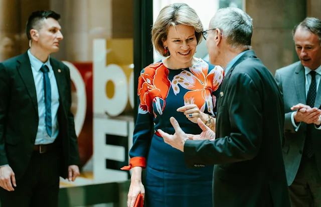 Queen Mathilde wore a navy blue coral floral printed long sleeved crepe dress by Etro, and red orange pumps by Natan