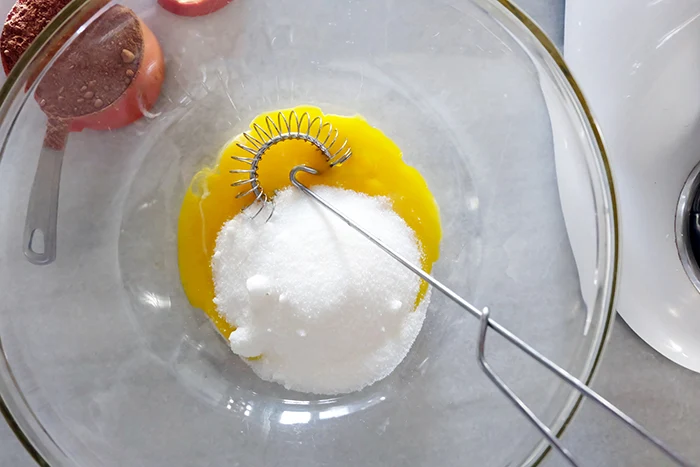 egg yolks and sugar in a bowl