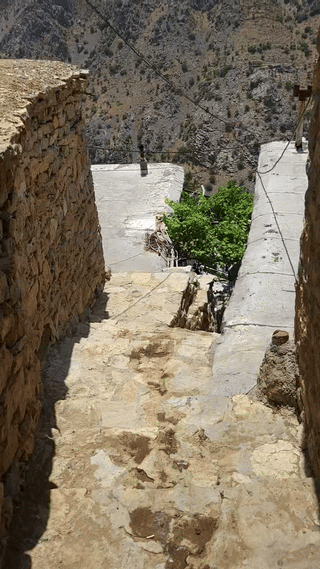 View of Uraman Takht from an alleyway