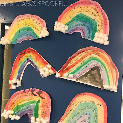 a display of children's artwork, watercolor rainbows