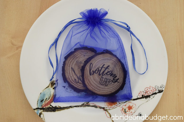 These DIY Wooden Coasters Wedding Favors are perfect for your rustic wedding. You can use actual fresh tree or purchased unfinished wood slices to make them.