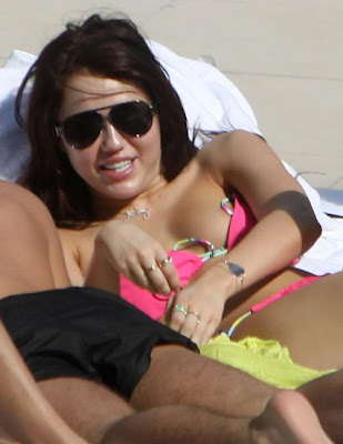 Miley Cyrus Nipple Here's Miley Cyrus enjoy soaking up in the sun at her 
