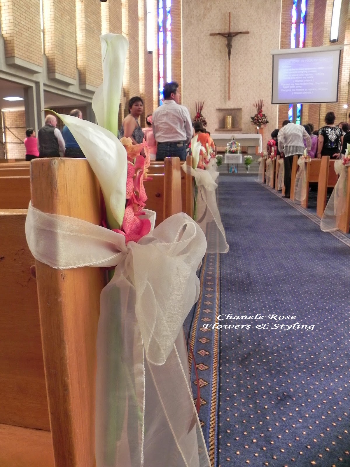 wedding pew bows church