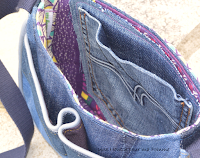 Sac à main Besace en jeans recyclés monté façon patchwork, intérieur coton ethnique coloris violet, turquoise, jaune, passepoil gris clair, deux poches en soufflet devant, biais gris clair sur le rabat, entièrement doublé pour le rendre semi-rigide, anse coton bleu marine, boucles couleur argent, surpiqures jaunes et rouge .  Dimensions : 24 x 18 x 7 cm environ.