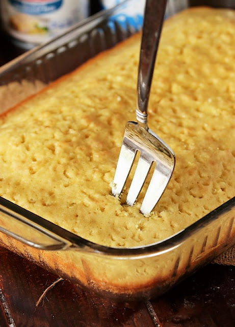 Poking Holes in Tres Leches Cake with Fork Image