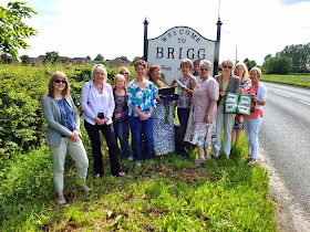 The Women's Institute Centenary Baton being handed over to Wrawby by Brigg at a ceremony beside the A18 - picture on Nigel Fisher's Brigg Blog