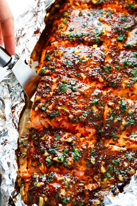 This Honey Mustard Salmon recipe features a homemade honey mustard sauce that is super delicious (and easy to adapt if you like to go heavier on the honey or mustard side). It can also be cooked quickly and easily in the oven or on the grill — your choice.