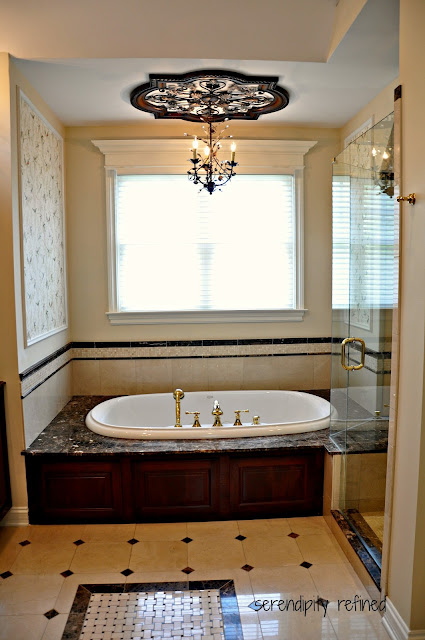 Dark Wood Master Bathroom Cabinets, Sconces, Mirrors Tile, Glass Shelves, Crema Marfil Marble, Emperador Dark Granite, shower, tile rug, mosaic, tub surround