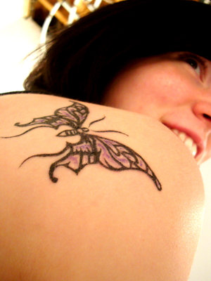 butterfly tattoo on upper back