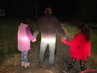 Dad holding 2 daughters' hands