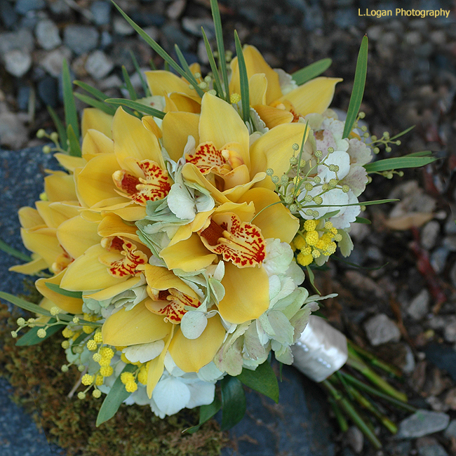 Yellow and white wedding bouquet idea with yellow orchids Image Sources