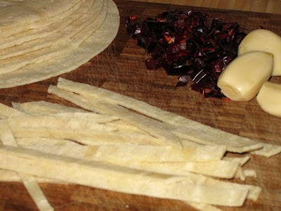 Cut corn tortillas into strips and fry