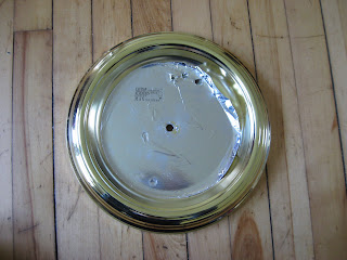 image of brass boob light fixture with lighting components removed