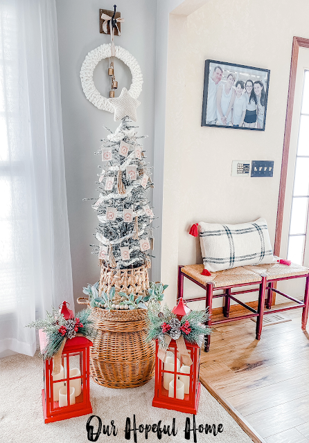 neutral Christmas tree with garland in basket