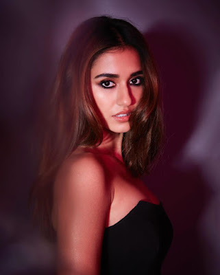 Disha Patani in black tube top sheath dress baring her chest and overflowing boobs
