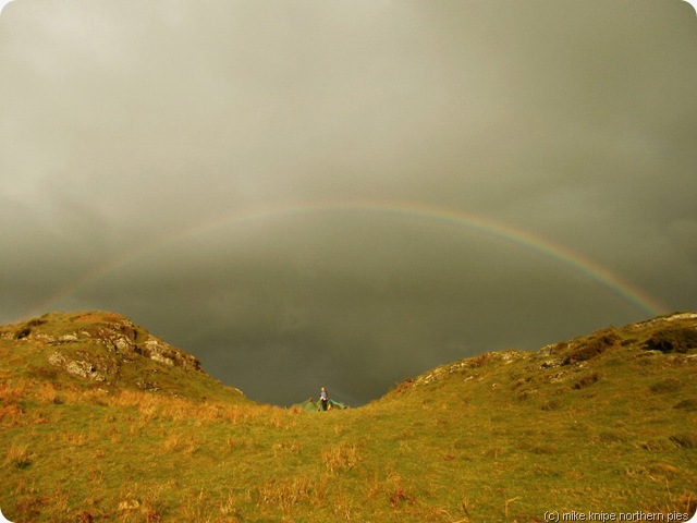 dawn beneath a rainbow at dawn
