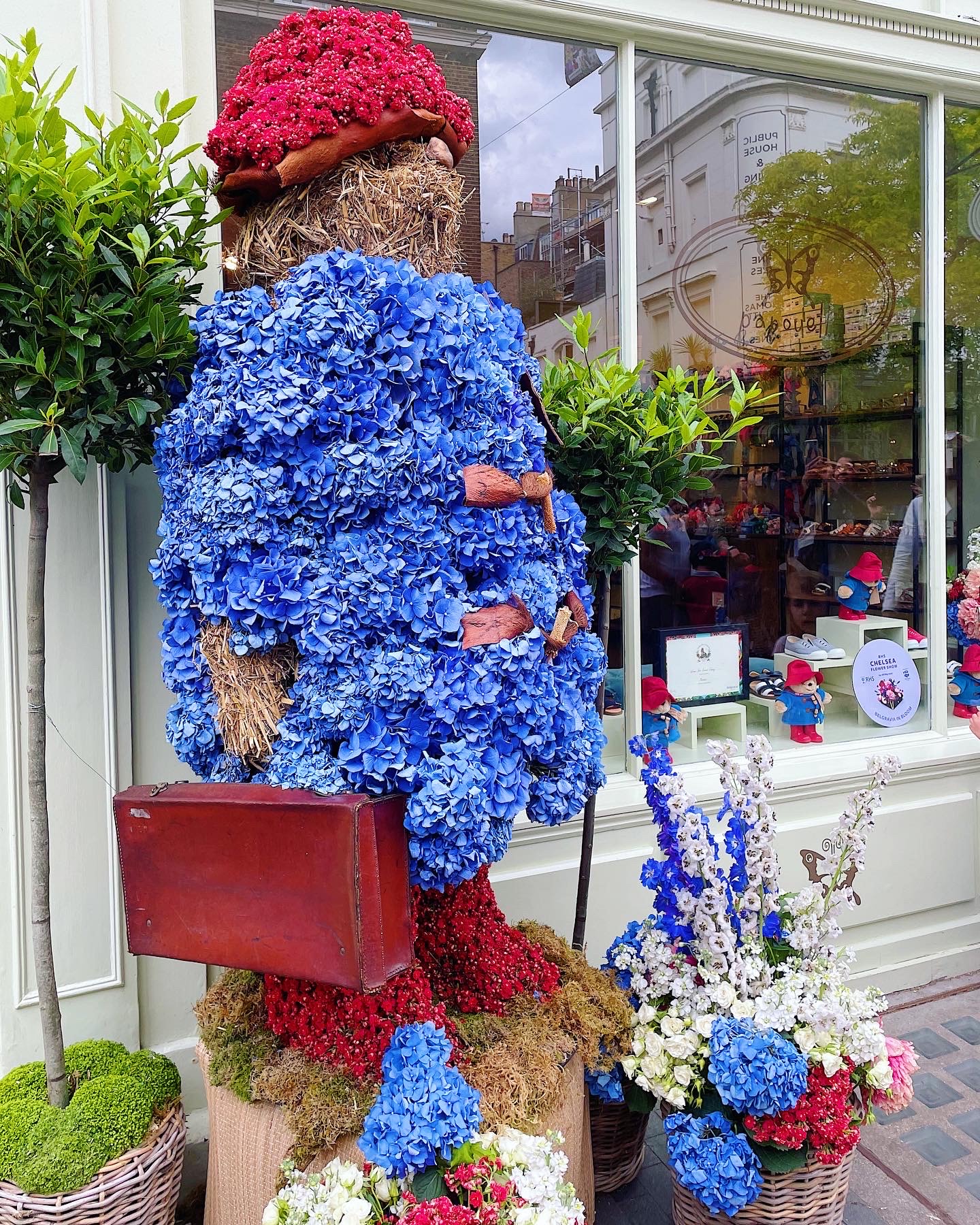 A large loral display shaped like Paddington bear.