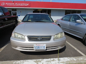 Dull, faded car paint on Toyota Camry.